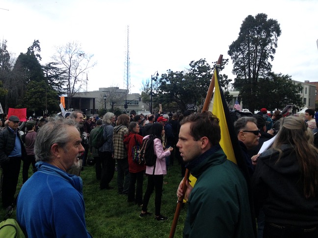 man with anarchist flag