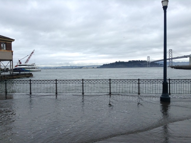 king tide at pier 14, ferry and bridge