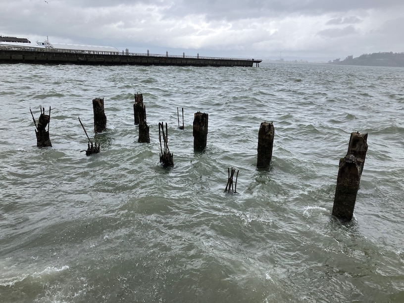 a storm roils bay near pier 14